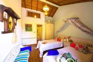 Łóżko lub łóżka w pokoju w obiekcie Cas do Mestre Casa rural con Encanto