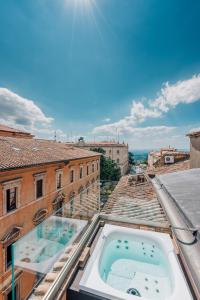 a view from the roof of a building with a hot tub at Locanda della Posta Boutique Hotel in Perugia