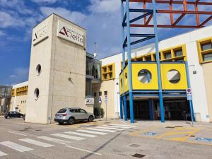 a car parked in a parking lot next to a building at Residence Delta in Rovigo