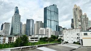 a view of a city with tall buildings at The Tangerine Guesthouse in Bangkok