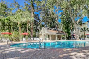 a swimming pool with a gazebo and a house at Greens 198 in Hilton Head Island