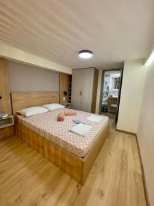 a bedroom with a large bed in a room at Minimal Two-Floor Apartment in Thessaloniki