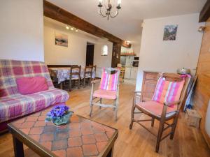 a living room with a couch and chairs and a table at Appartement Valloire, 2 pièces, 5 personnes - FR-1-263-161 in Valloire