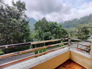 a balcony with a view of the mountains at DreamCatcher Boutique Hotels in Bhīm Tāl