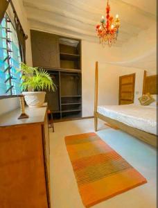 En eller flere senger på et rom på Malindivillabaobab