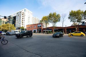 a group of cars parked in a parking lot at Luxury Apartment at Condor Center in Tirana