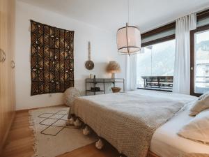 Łóżko lub łóżka w pokoju w obiekcie Apartment Tauernspirit by Interhome