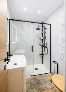 a bathroom with a shower and a white sink at Nice Renting - OFFENBACH - Luxury Apartment Fully Equipped Center in Nice
