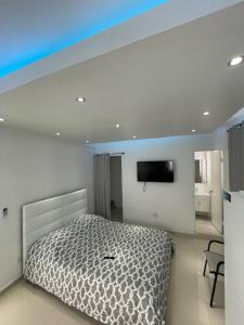 A bed or beds in a room at 1058 Modern Hotel