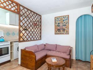 a living room with a couch and a table at Apartment Rosemary by Interhome in Palau