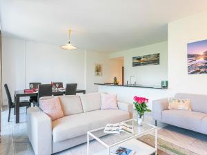 a living room with a couch and a table at Apartment Le Jazz by Interhome in Montreux