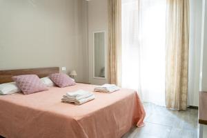 Postel nebo postele na pokoji v ubytování Gennaro Holidays