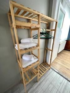 a wooden bunk bed with towels on a shelf at SULTANAHMET ROYAL APART in Istanbul