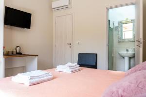 Postel nebo postele na pokoji v ubytování Gennaro Holidays