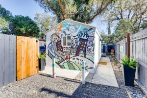 a smallshed with a painting on the side of it at TINY ART HOUSE near the beat in Sacramento