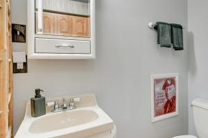 a bathroom with a sink and a toilet at Cozy Montello Hideaway Near Puckaway Lake Access! in Montello +24 photos