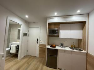 Kuchyňa alebo kuchynka v ubytovaní Apartamentos La Solana