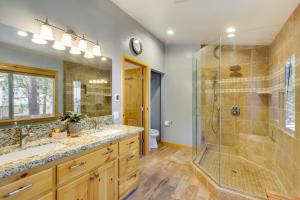 a bathroom with two sinks and a shower at Central Big Bear Lake Retreat with Private Hot Tub! in Big Bear Lake +20 photos