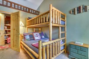a bedroom with a bunk bed with a ladder at Central Big Bear Lake Retreat with Private Hot Tub! in Big Bear Lake