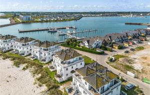 an aerial view of a harbor with houses and a dock at Biscaya in Olpenitz