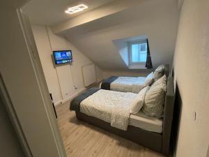 Cama o camas de una habitación en Ferienwohnung Rastatt