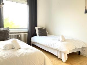 Furnished 2 Bedroom Apartmet I Fredericia tesisinde bir odada yatak veya yataklar