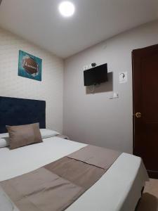 Llit o llits en una habitació de Hotel Bahia Suite