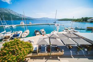 a marina with boats docked in the water at Apartments and Rooms Denoble in Korčula