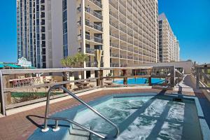 a hot tub on the balcony of a building at SunDestin 1415 in Destin