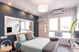A bed or beds in a room at Oleti Studio Granada