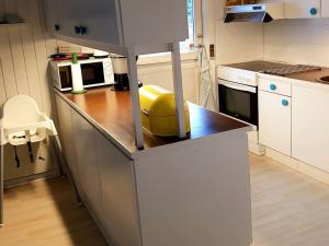 a kitchen with a counter with a yellow appliance on it at Holiday Home Asmine - 670m from the sea in Lolland- Falster and Mon by Interhome in Dannemare