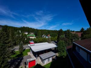 an overhead view of a building with a white roof at Apartment Harrachov 497-2 by Interhome in Harrachov