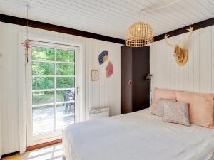 Postel nebo postele na pokoji v ubytování Holiday Home Øllegård - 250m from the sea by Interhome + 15 fotografií