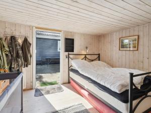 En eller flere senge i et værelse på Holiday Home Imma - 200m from the sea in Sealand by Interhome