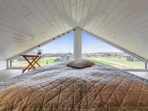 En eller flere senge i et værelse på Holiday Home Alea - 800m from the sea in NW Jutland by Interhome
