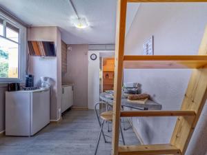a small kitchen with a bunk bed in a room at Studio Soyouz Vanguard-98 by Interhome in Le Corbier