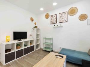 A television and/or entertainment centre at Holiday Home La Rosaleda by Interhome