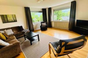 a living room with a couch and a table at Goethestraße Ferienhaus in Bad Harzburg