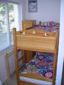a bedroom with two bunk beds and a window at Iglika 2 - Studio Cabin in Borovets