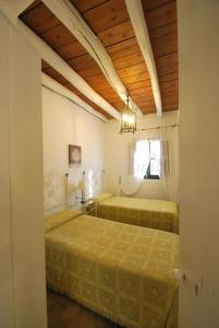 Cama o camas de una habitación en Finca La Vicaria Alameda