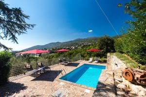 a swimming pool with a view of a mountain at Villa Capra Verde in Ičići