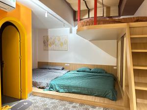 a bedroom with two bunk beds and a staircase at A4 Home - Ha Long city Central in Ha Long