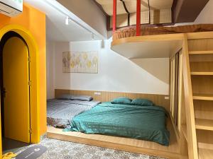 a bedroom with two bunk beds and a staircase at A4 Home - Ha Long city Central in Ha Long +5 photos