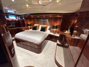 a bedroom on a boat with a bed and a desk at Super Yacht Located in Puerto Banus in Marbella