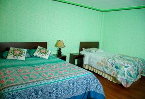 Postel nebo postele na pokoji v ubytování HOSTAL SALARCITO