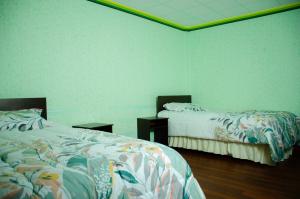 Postel nebo postele na pokoji v ubytování HOSTAL SALARCITO
