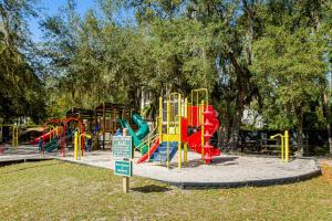 a playground in a park with a colorful slide at HH Beach & Tennis 132C in Hilton Head Island