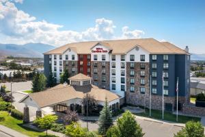 an aerial view of a hotel with mountains in the background at Hilton Garden Inn Missoula in Missoula