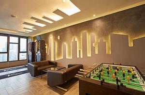 a living room with a pool table and a couch at Luxurious Ceylonz Suite near Bukit Bintang 4pax in Kuala Lumpur