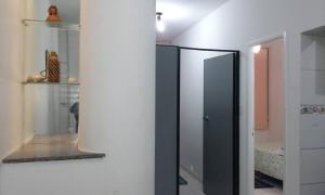 a bathroom with a black mirror in a room at Apartamento Pelourinho in Salvador +10 photos